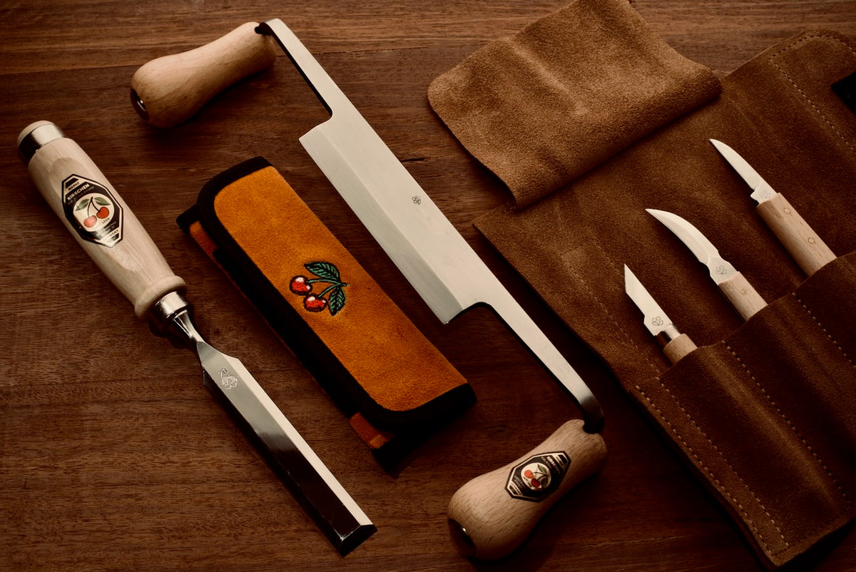 Hand plane and wood shavings on a workbench